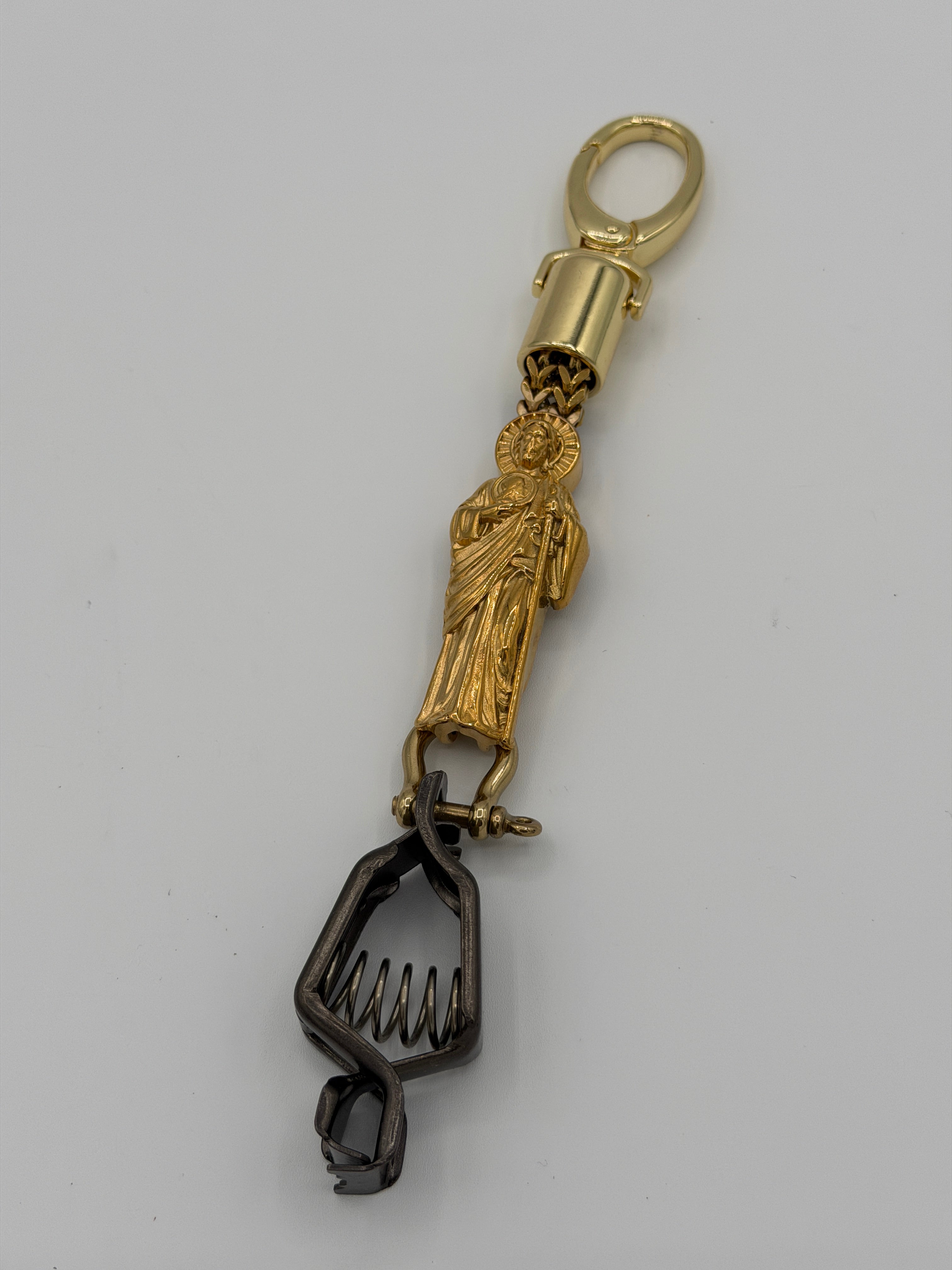 Gold San Judas glove clip
